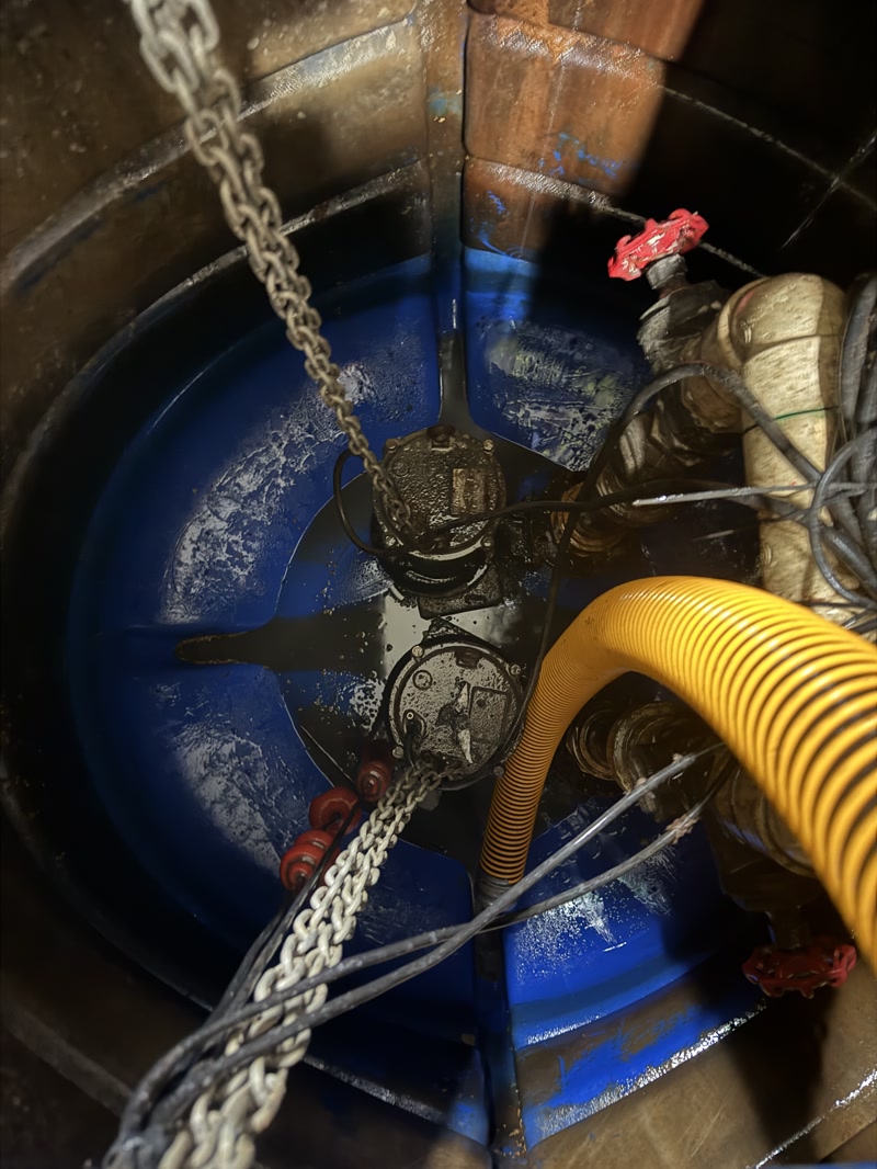Vacuum hoses positioned inside a circular wet well