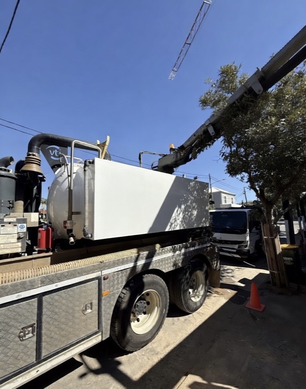 Compact vac truck on street near construction site Sydney
