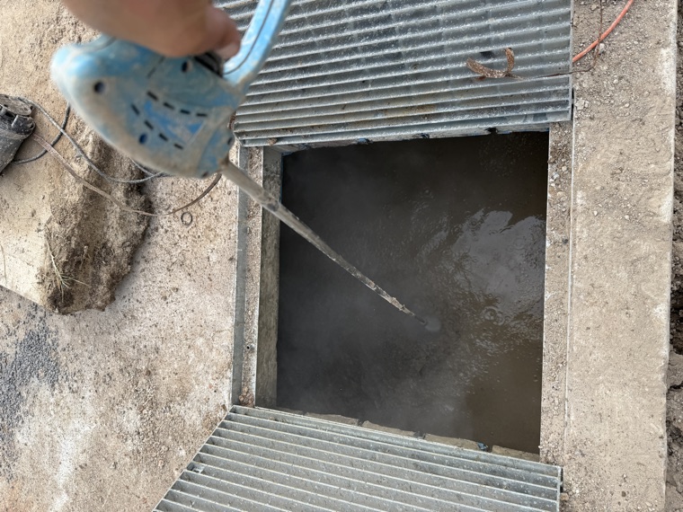 Stormwater pit cleaning with handheld tool vac truck Sydney
